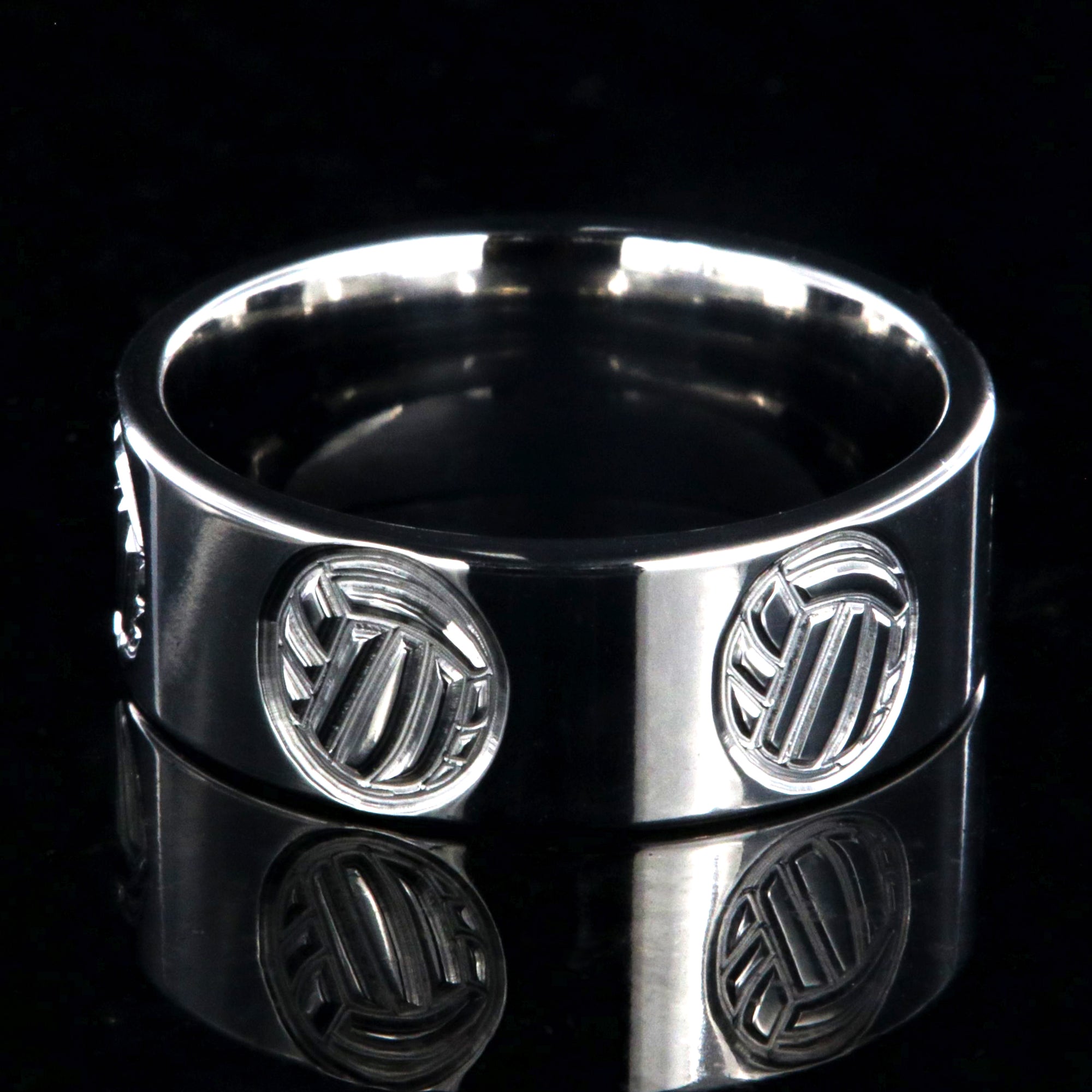 8mm wide titanium ring with milled volleyball design and flat profile