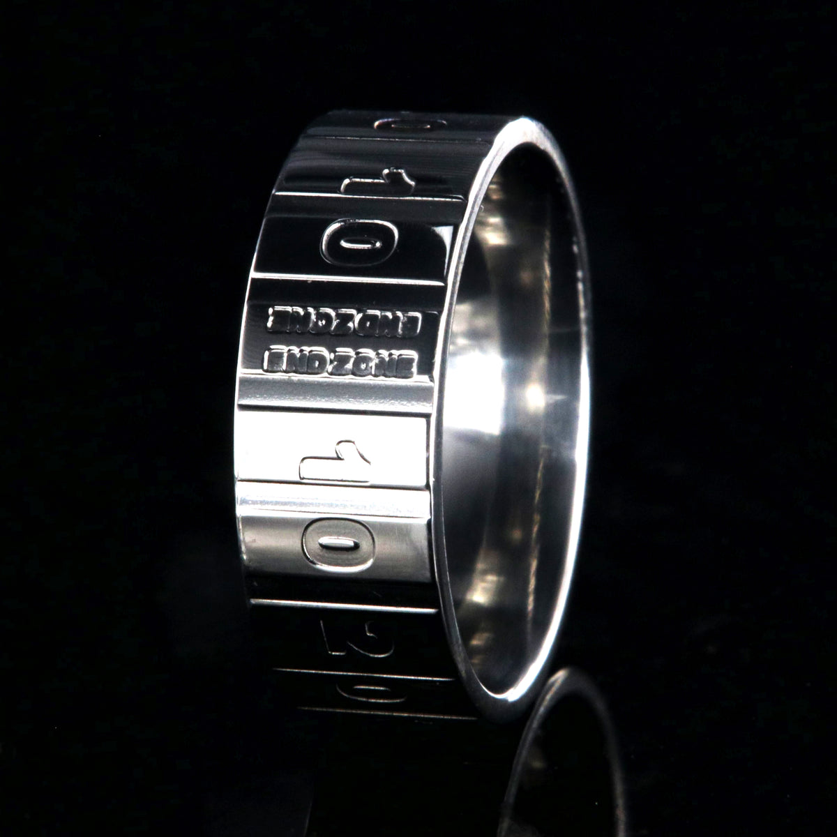 8mm wide titanium football ring with a yardage design