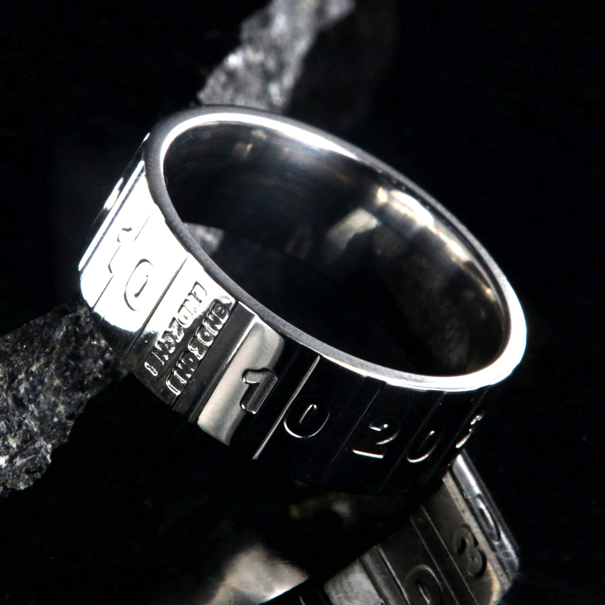 8mm wide titanium football ring with a yardage design