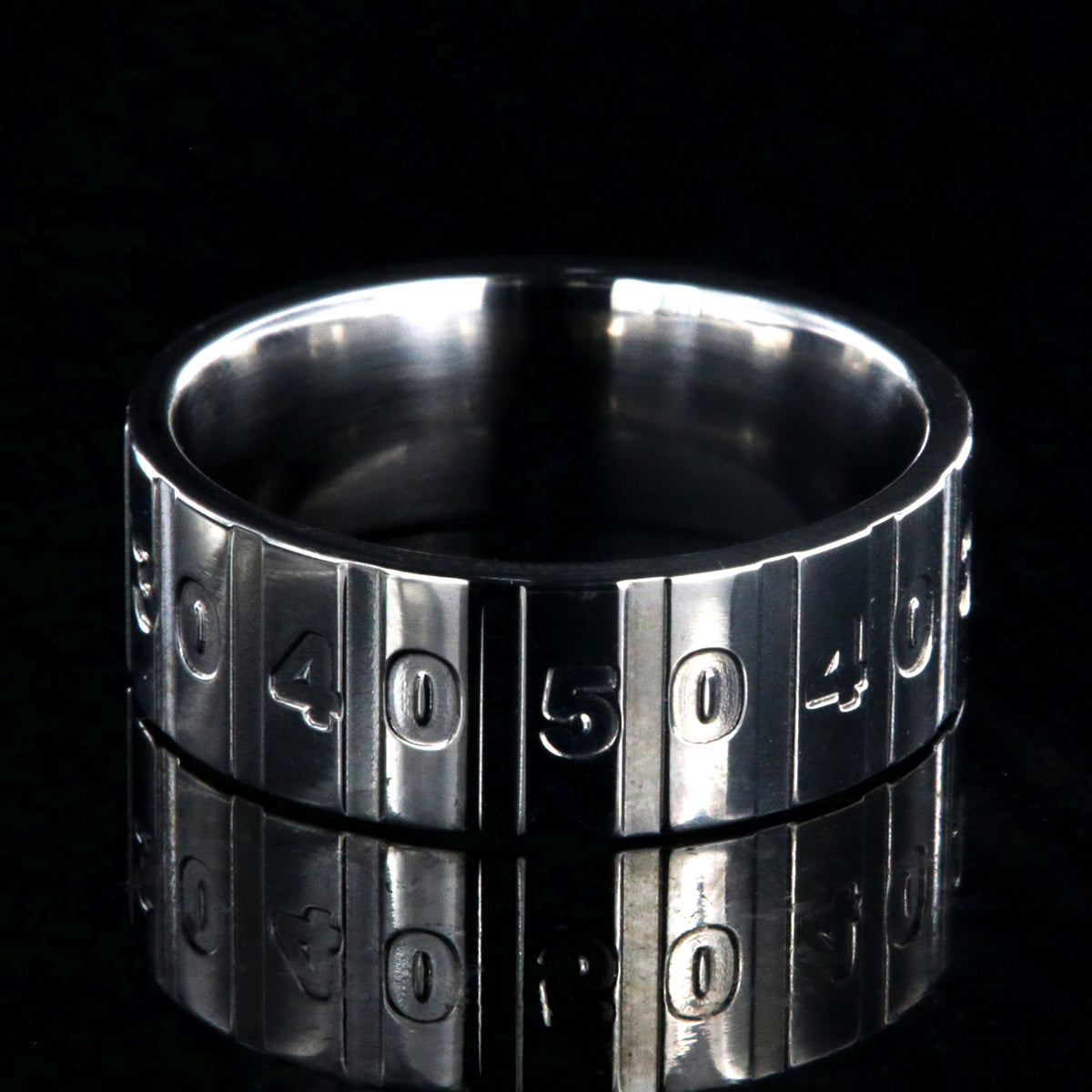 8mm wide titanium football ring with a yardage design