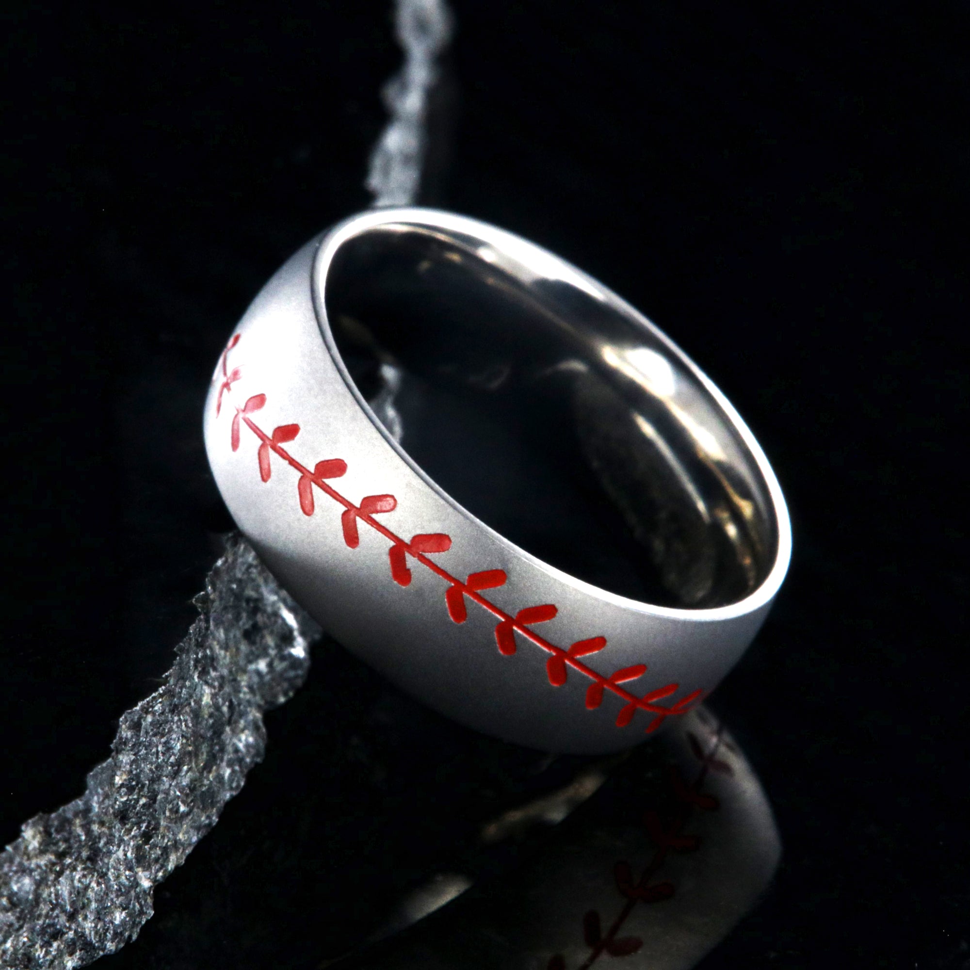 8mm wide titanium baseball ring with red stitching and a brushed finish