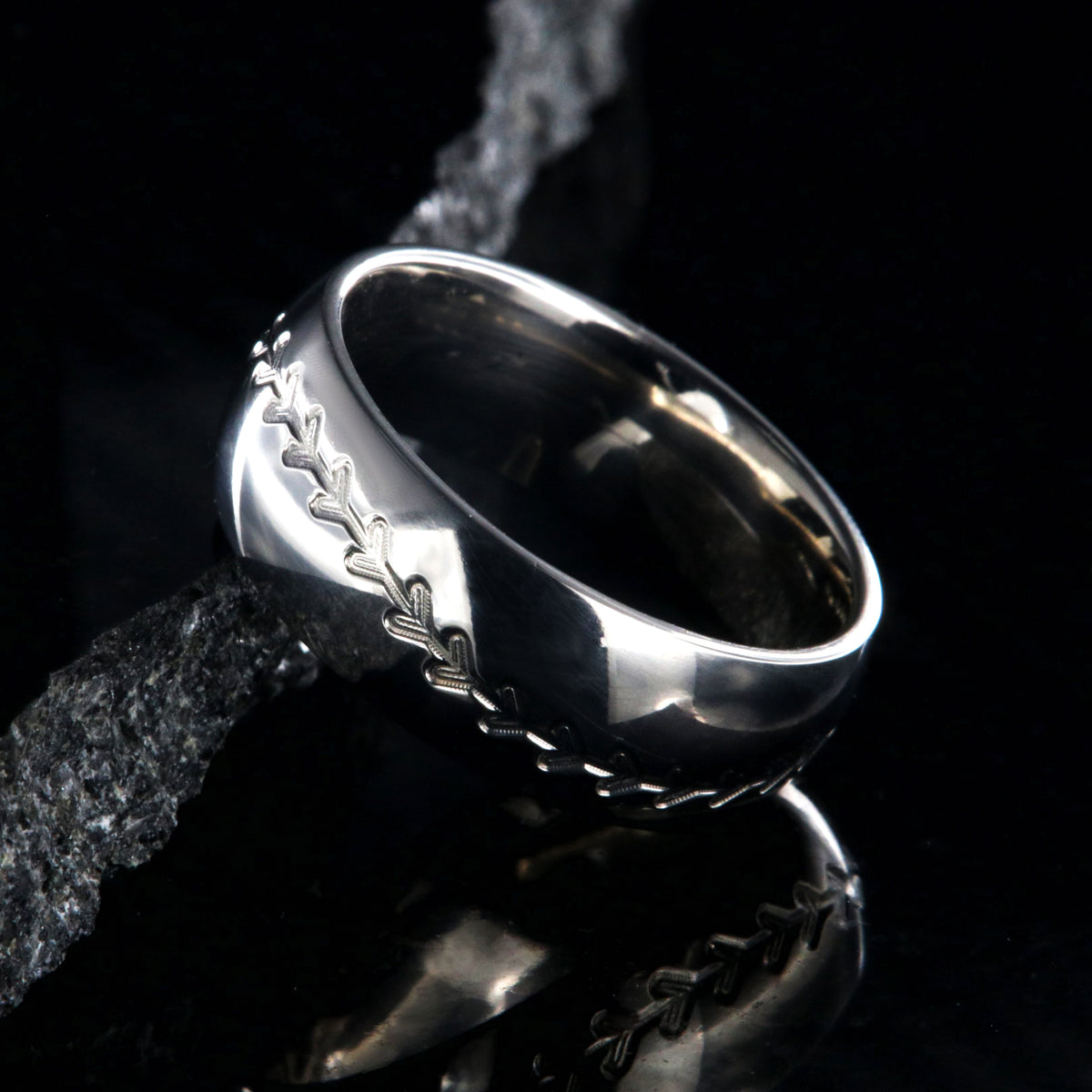 8mm wide titanium baseball ring with milled stitching and a rounded profile