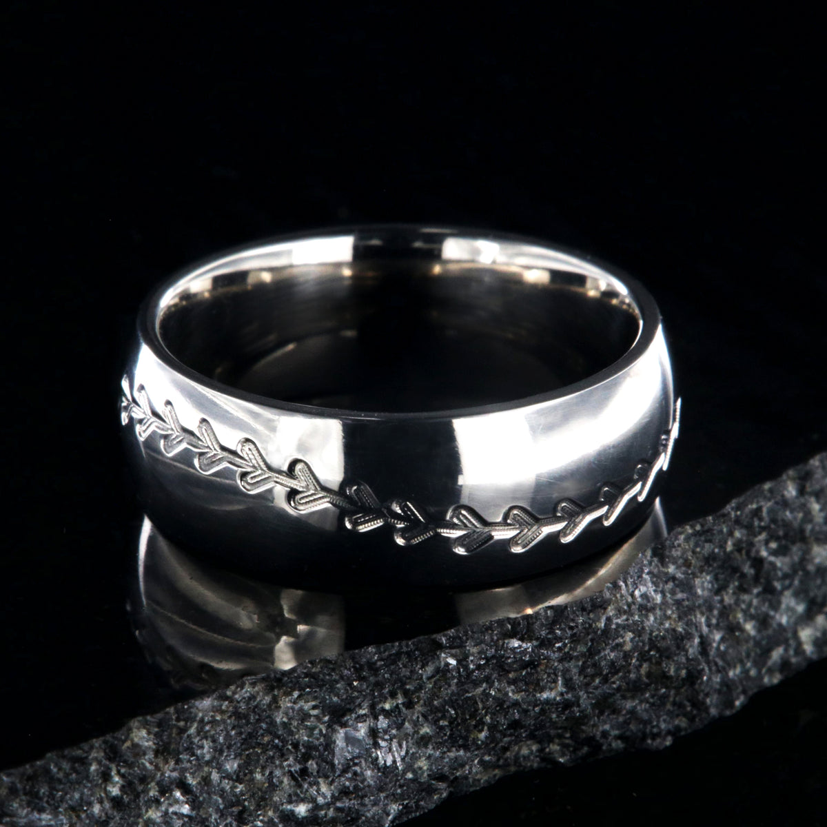 8mm wide titanium baseball ring with milled stitching and a rounded profile
