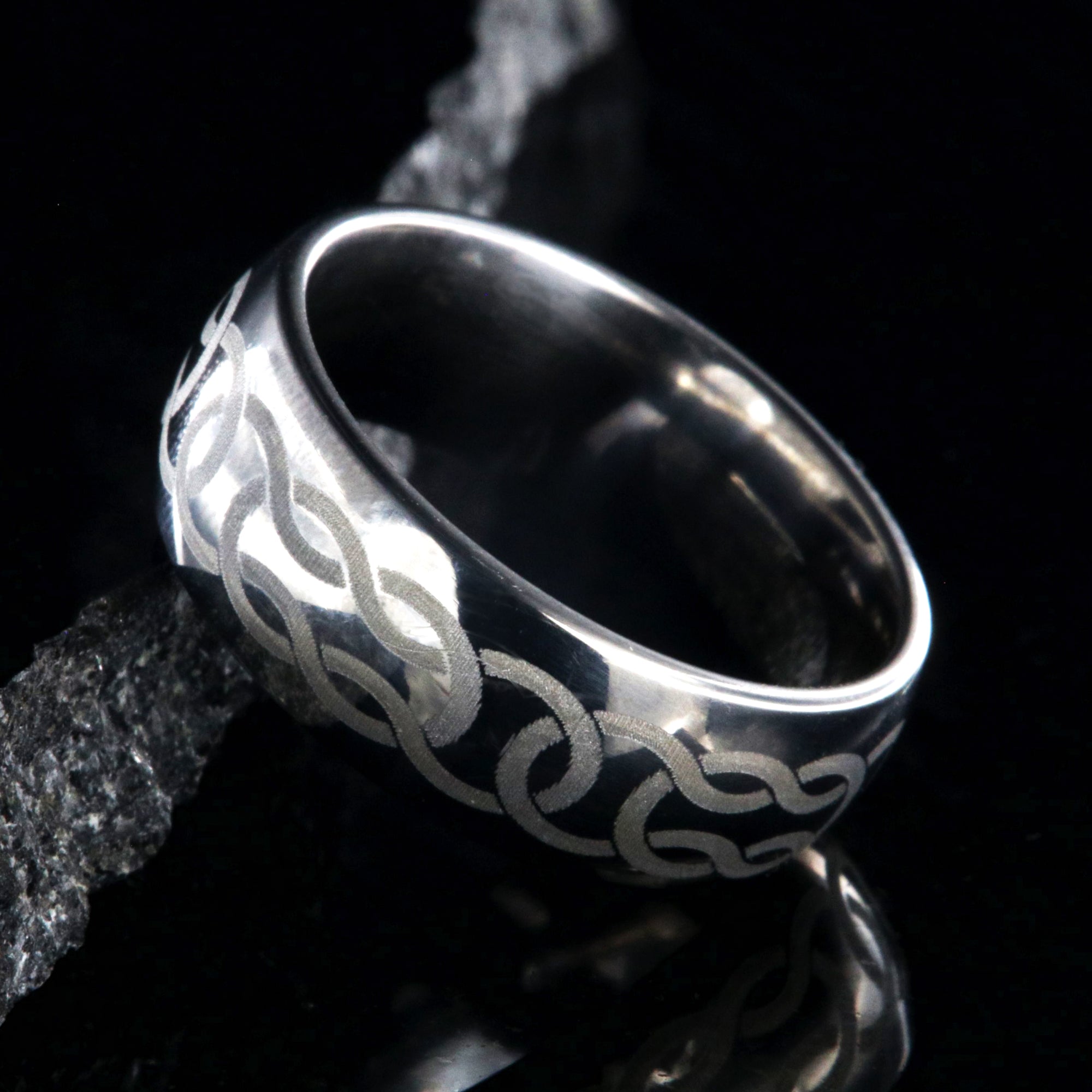 8mm wide titanium ring with Celtic knot design and rounded profile