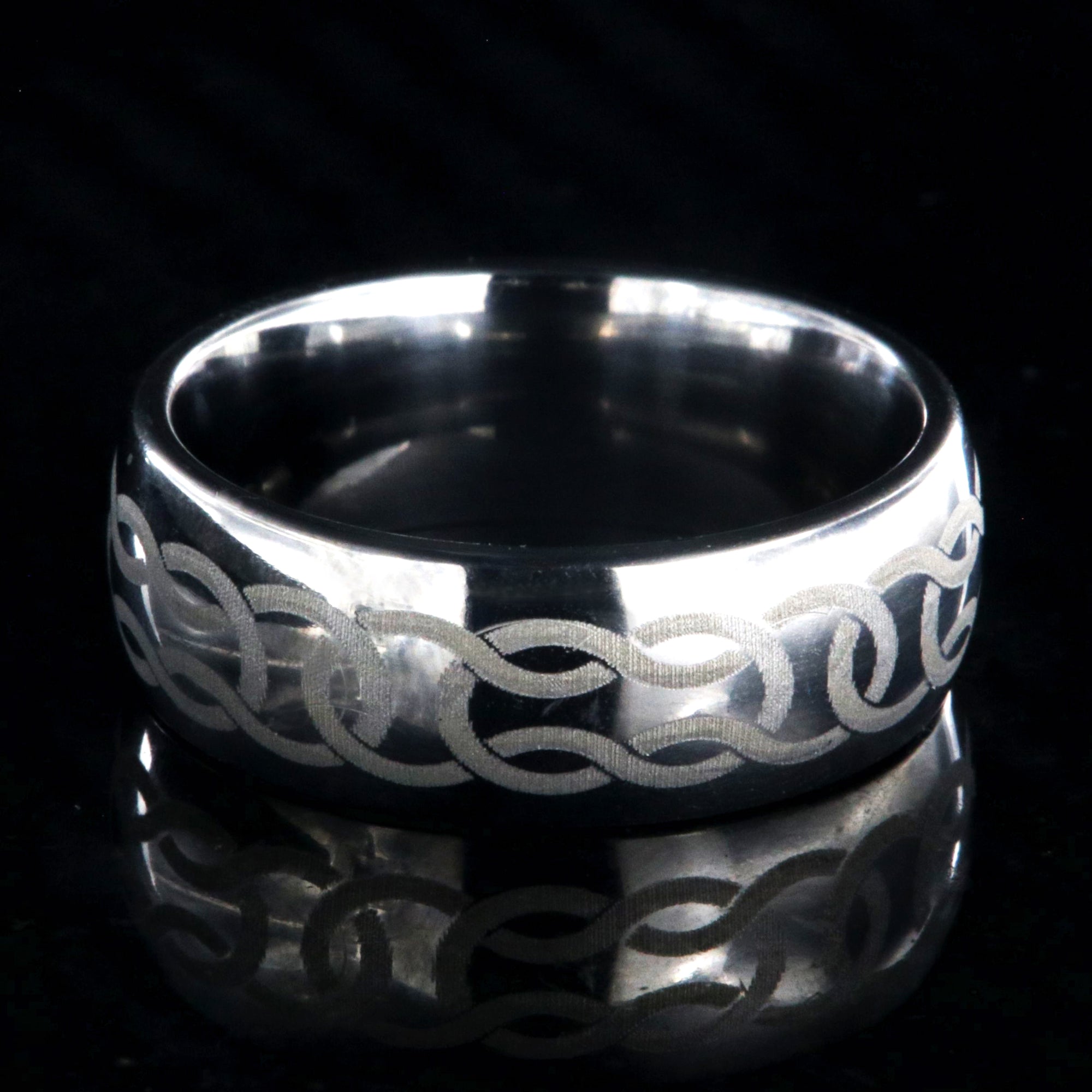8mm wide titanium ring with Celtic knot design and rounded profile