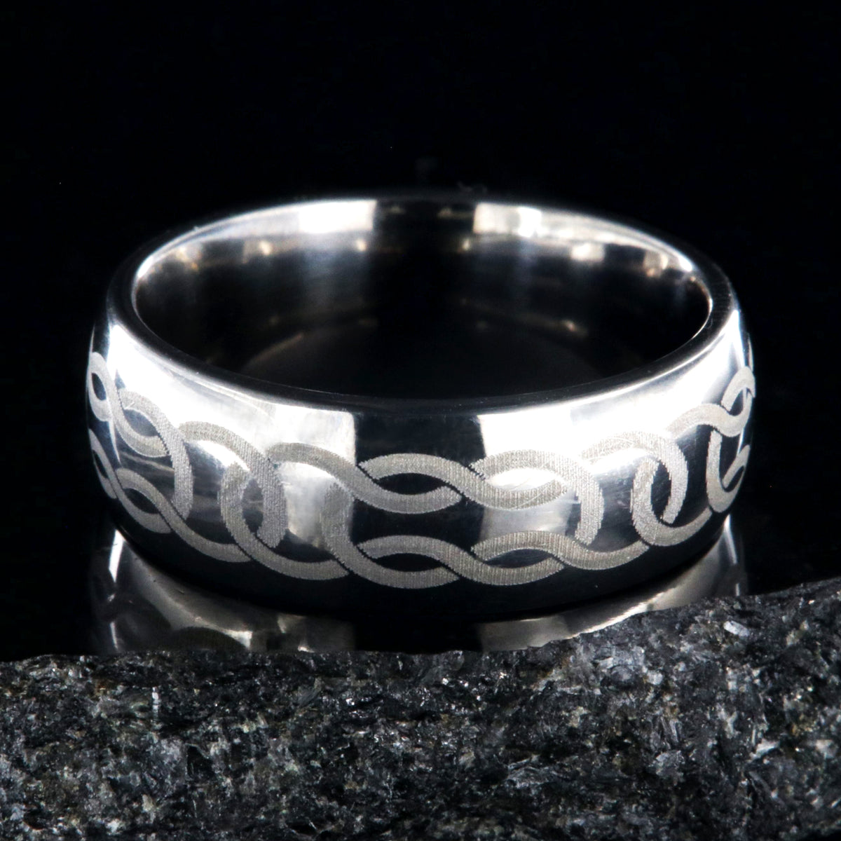 8mm wide titanium ring with Celtic knot design and rounded profile