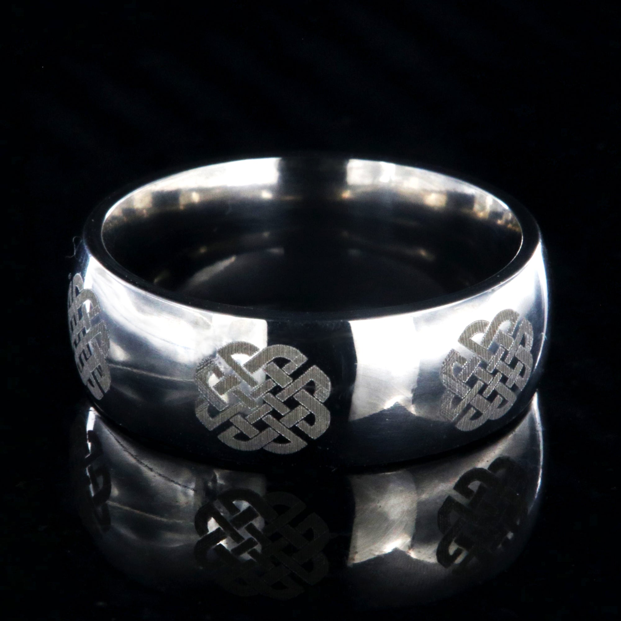 8mm wide titanium ring with Celtic knot design