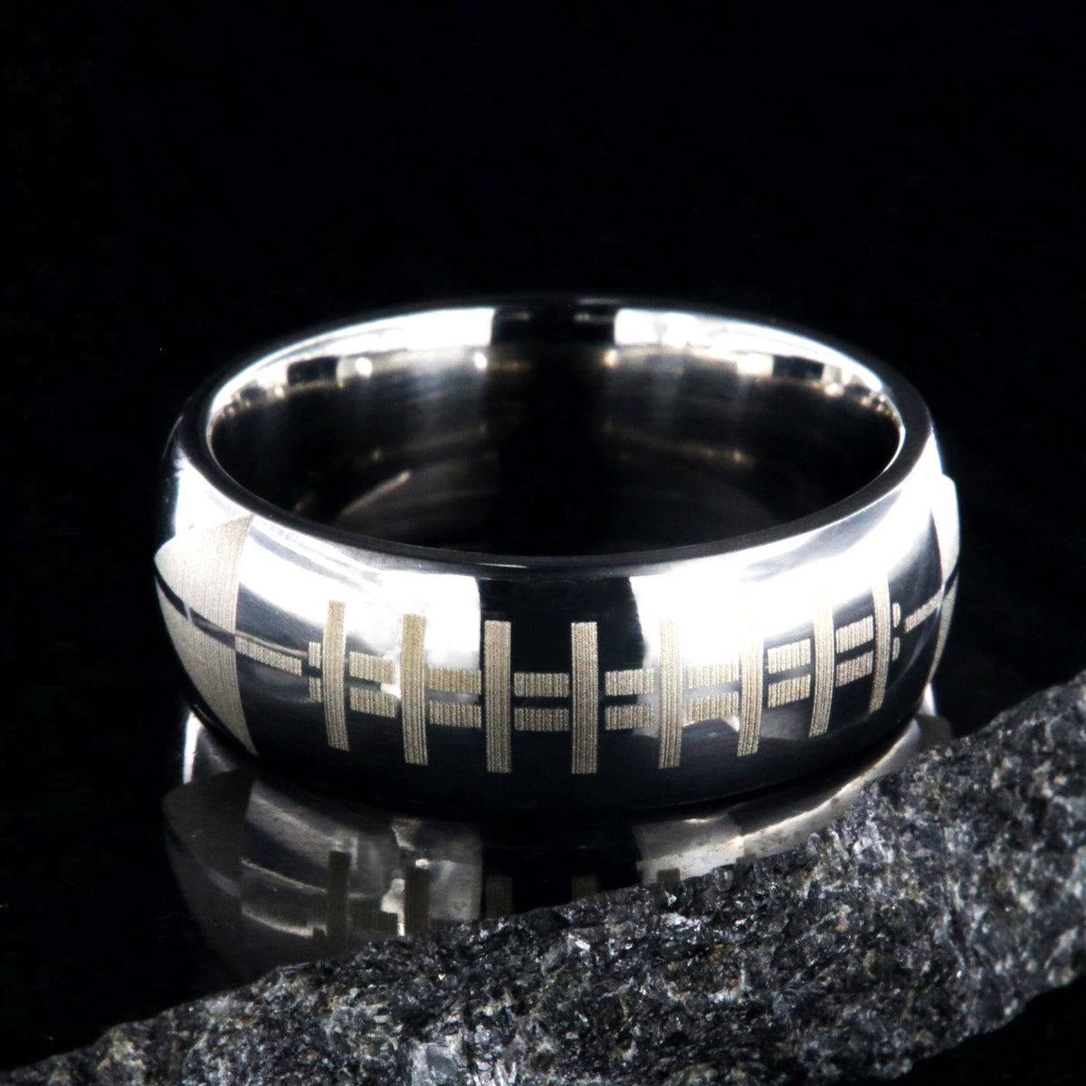 8mm wide titanium football ring with layered football design 