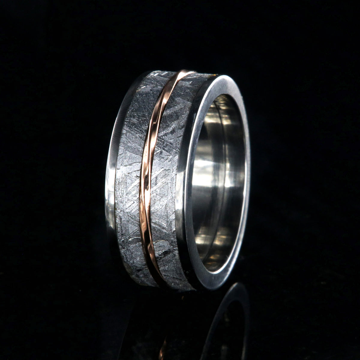 10mm wide Gibeon meteorite wedding band for men with twisted rose gold inlay