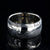 1mm wide black Damascus steel wedding band with a 2.5mm wide white gold inlay and white gold sleeve
