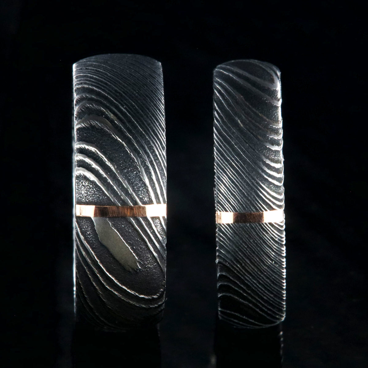 8mm and 6mm wide Damascus steel wedding band set with vertical rose gold inlay
