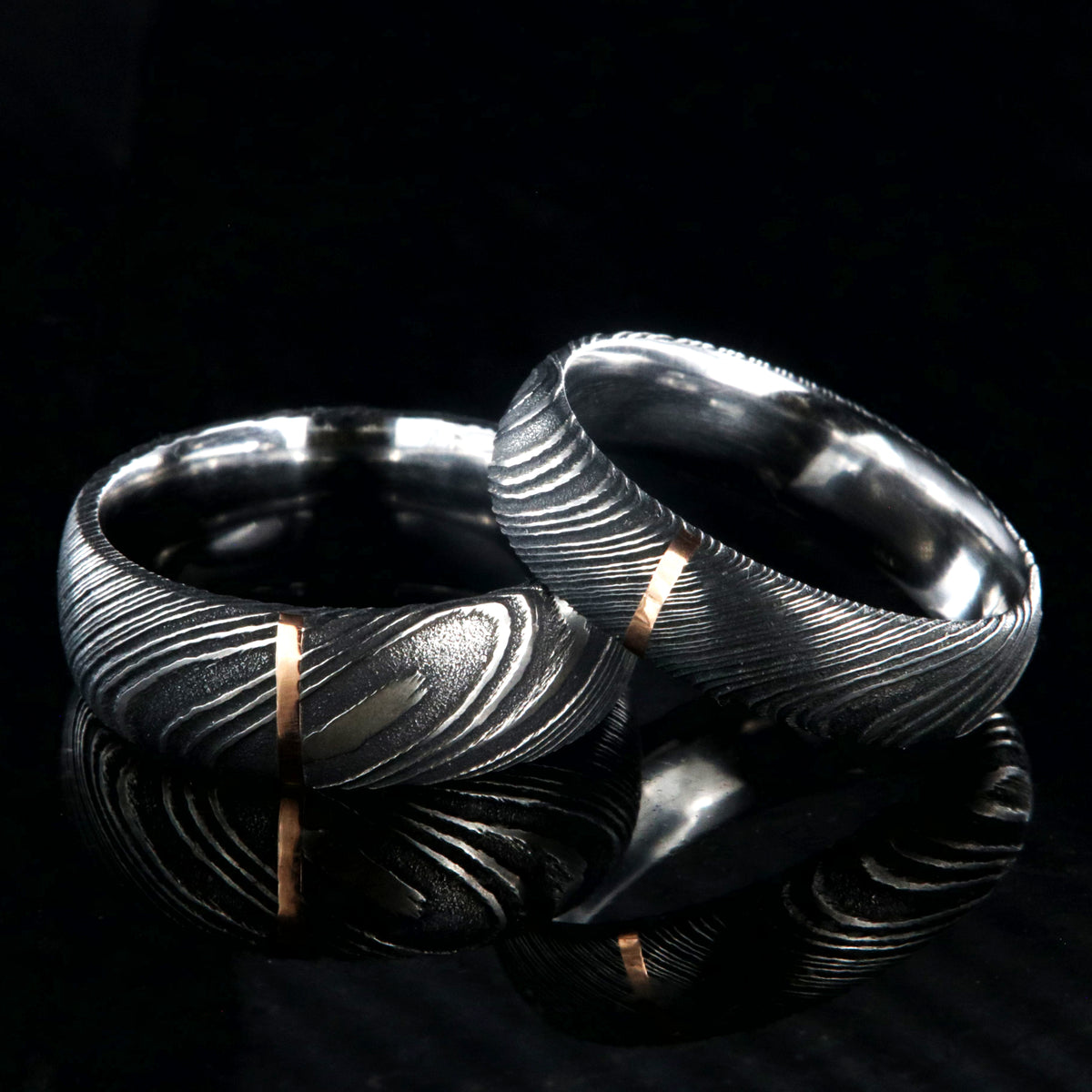 8mm and 6mm wide Damascus steel wedding band set with vertical rose gold inlay