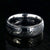 8mm wide black Damascus steel wedding ring with rounded profile, polished inside, and hammered black titanium inlay