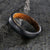 5mm wide black titanium wedding band with a distressed finish, rounded profile, and whiskey barrel sleeve
