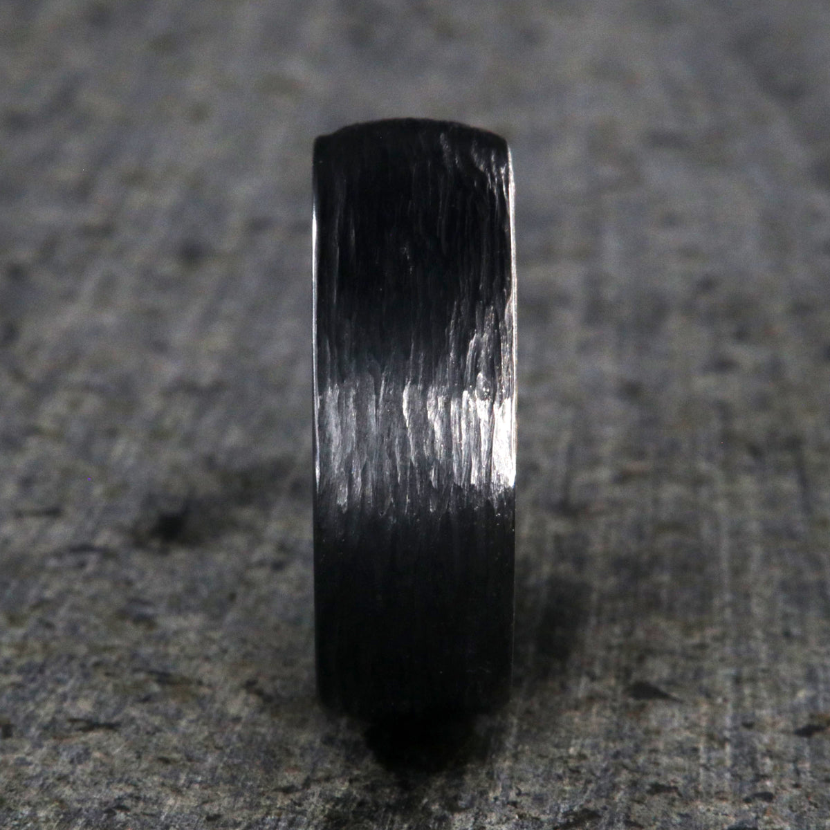 8mm with black titanium wedding band with a tree bark finish and whiskey barrel sleeve