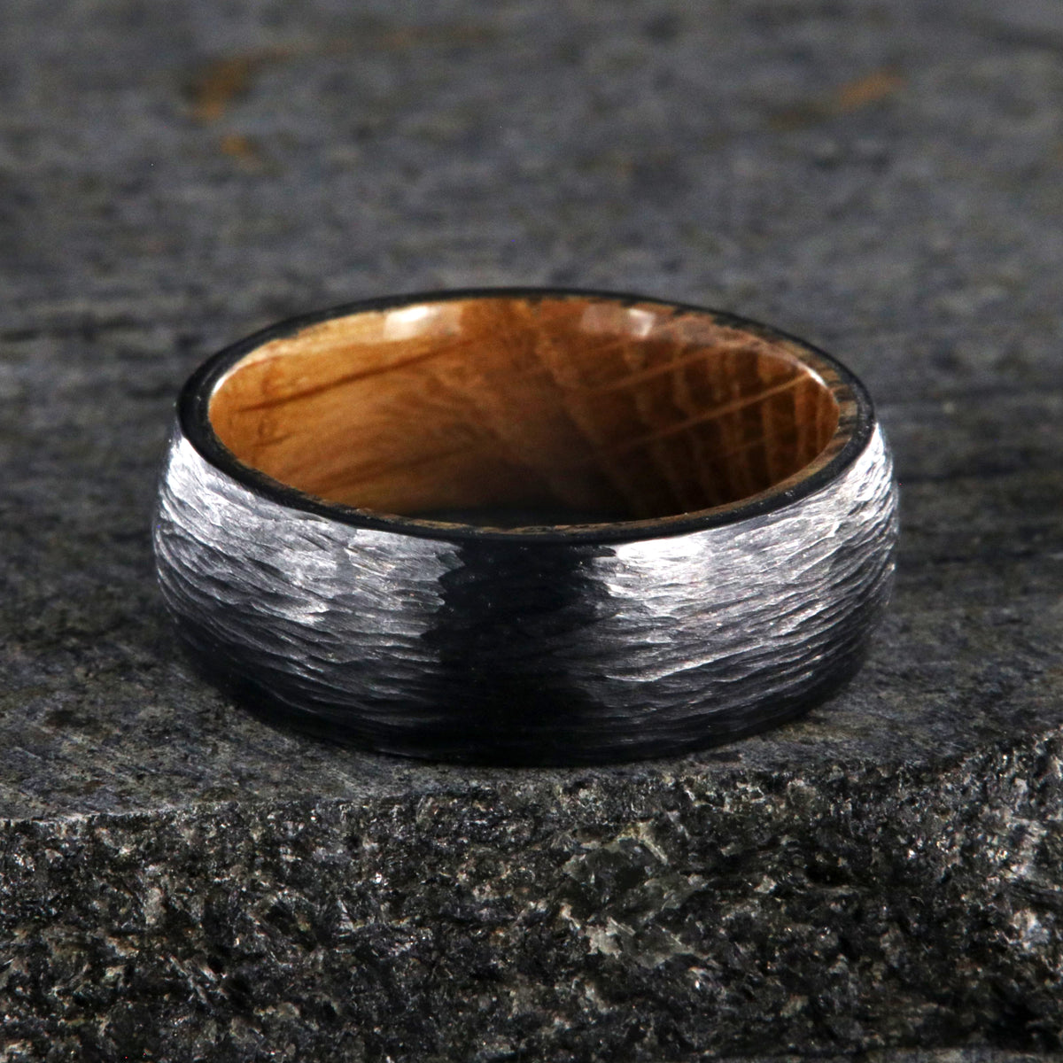 8mm with black titanium wedding band with a tree bark finish and whiskey barrel sleeve
