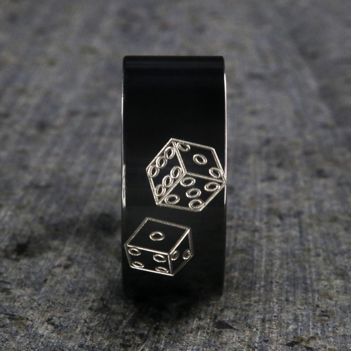 10mm wide black zirconium wedding band with an etched pair of die and a flat profile