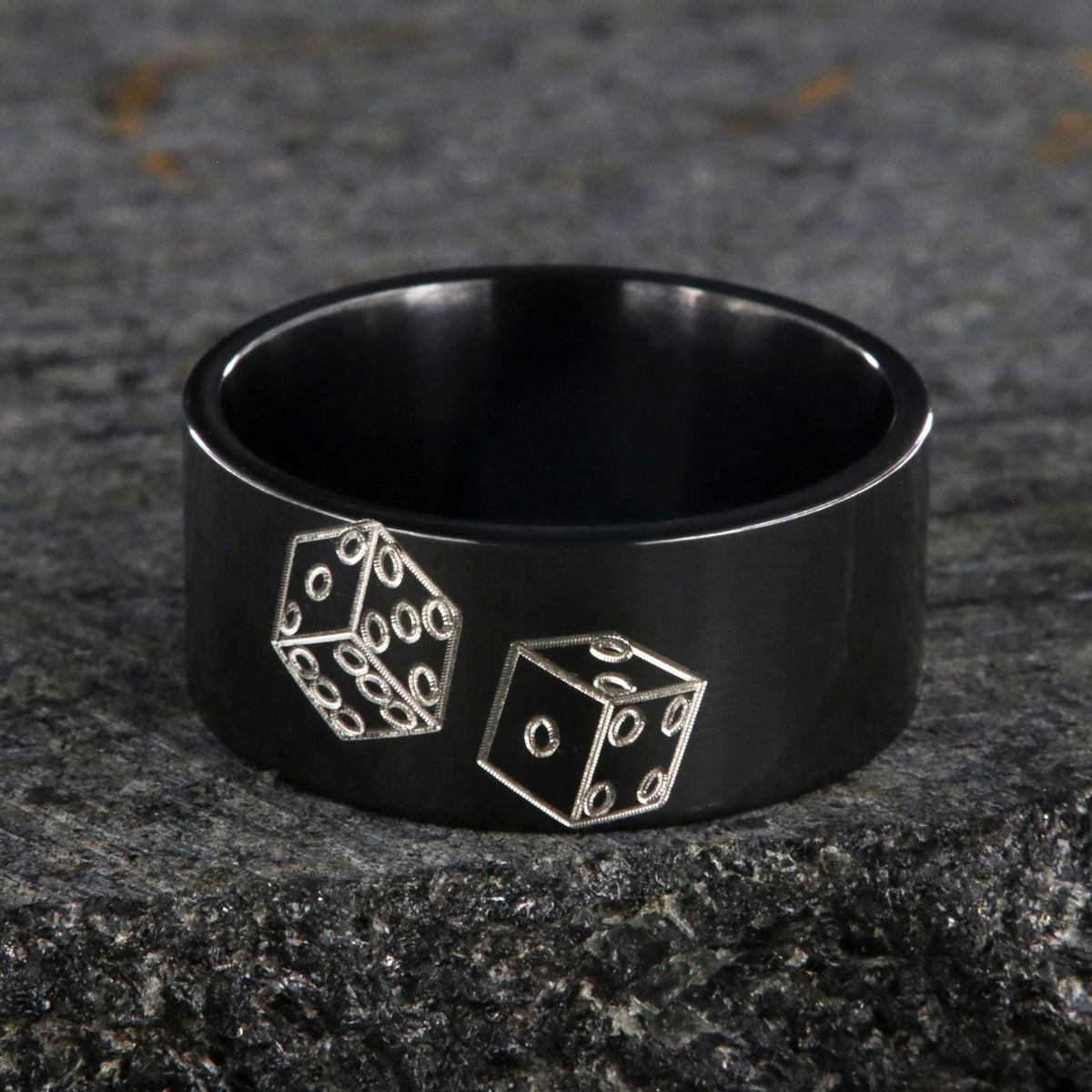 10mm wide black zirconium wedding band with an etched pair of die and a flat profile