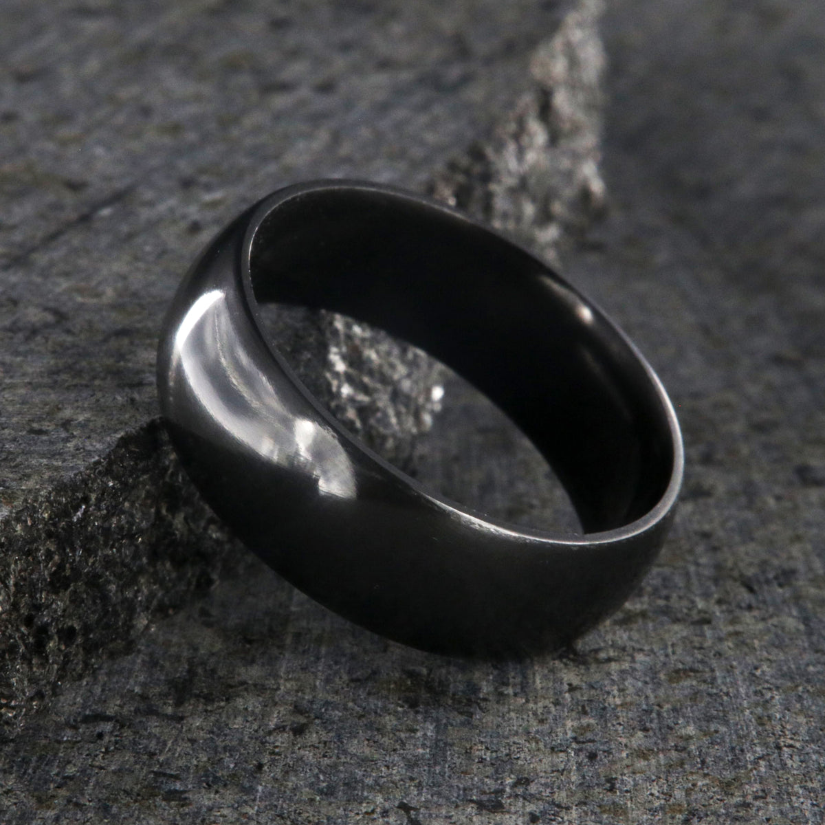 8mm wide black zirconium wedding band with a polish finish and rounded profile