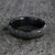 5mm wide black zirconium ring with a raised-center and tree bark finish