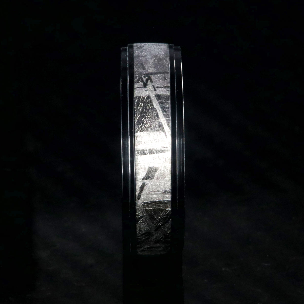 6mm wide men&#39;s meteorite wedding band with a raised center and black zirconium step edges and sleeve