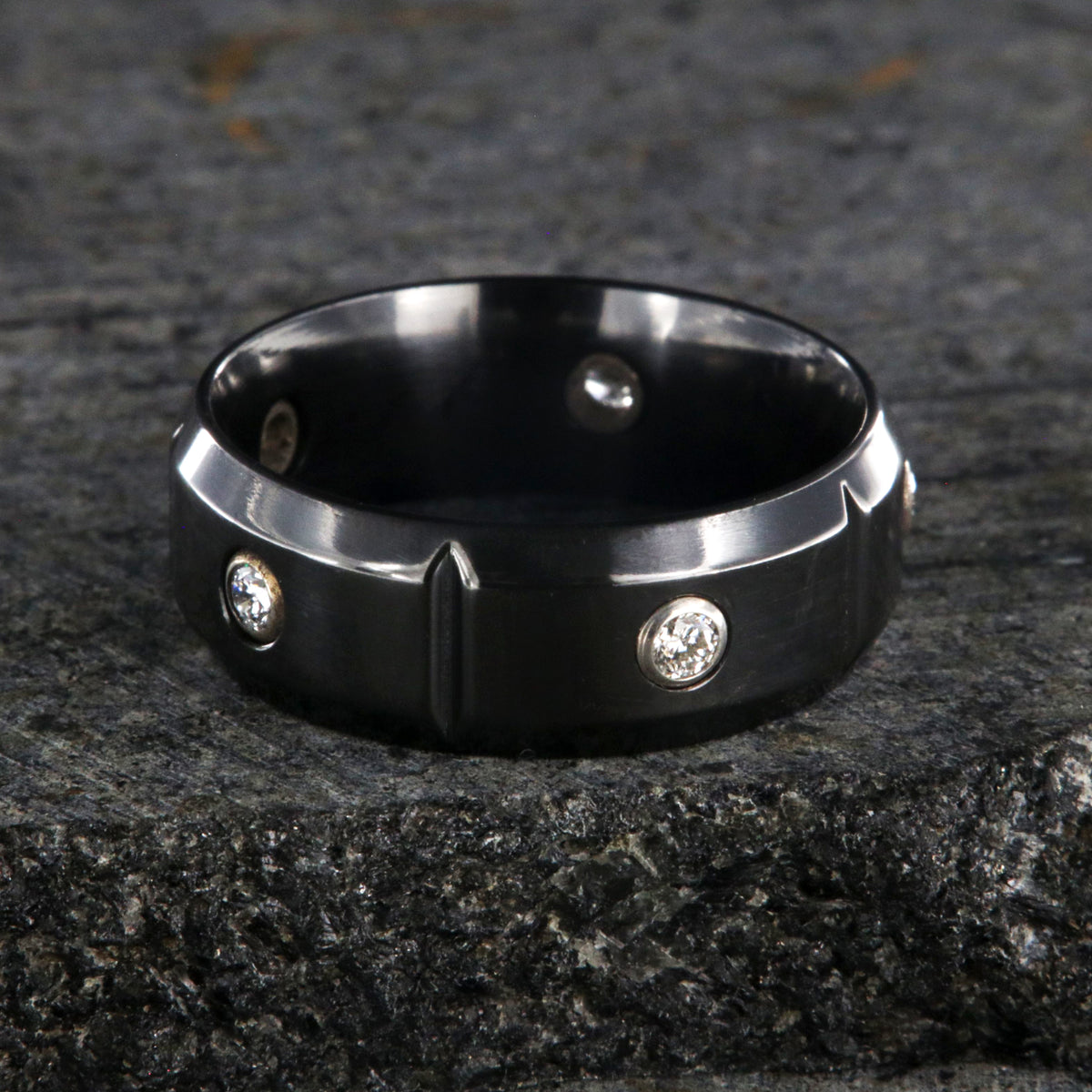 8mm wide black zirconium wedding band with 5 diamonds, beveled edges, and vertical grooves