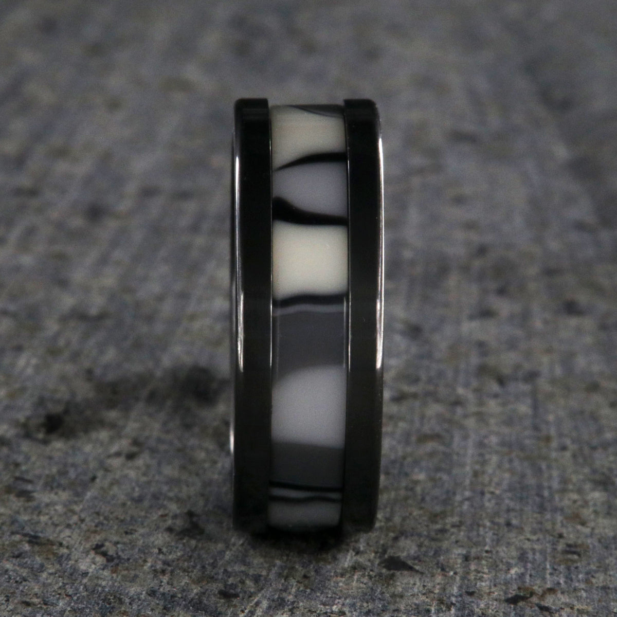 8mm wide black zirconium ring with a black and white camouflage patterned inlay