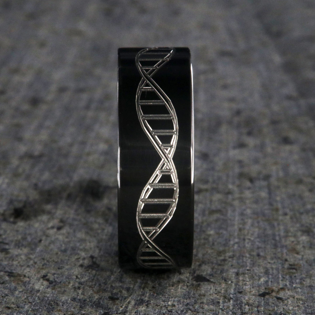 8mm wide black zirconium wedding ring with an etched DNA design