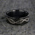 8mm wide black zirconium wedding ring with an etched DNA design
