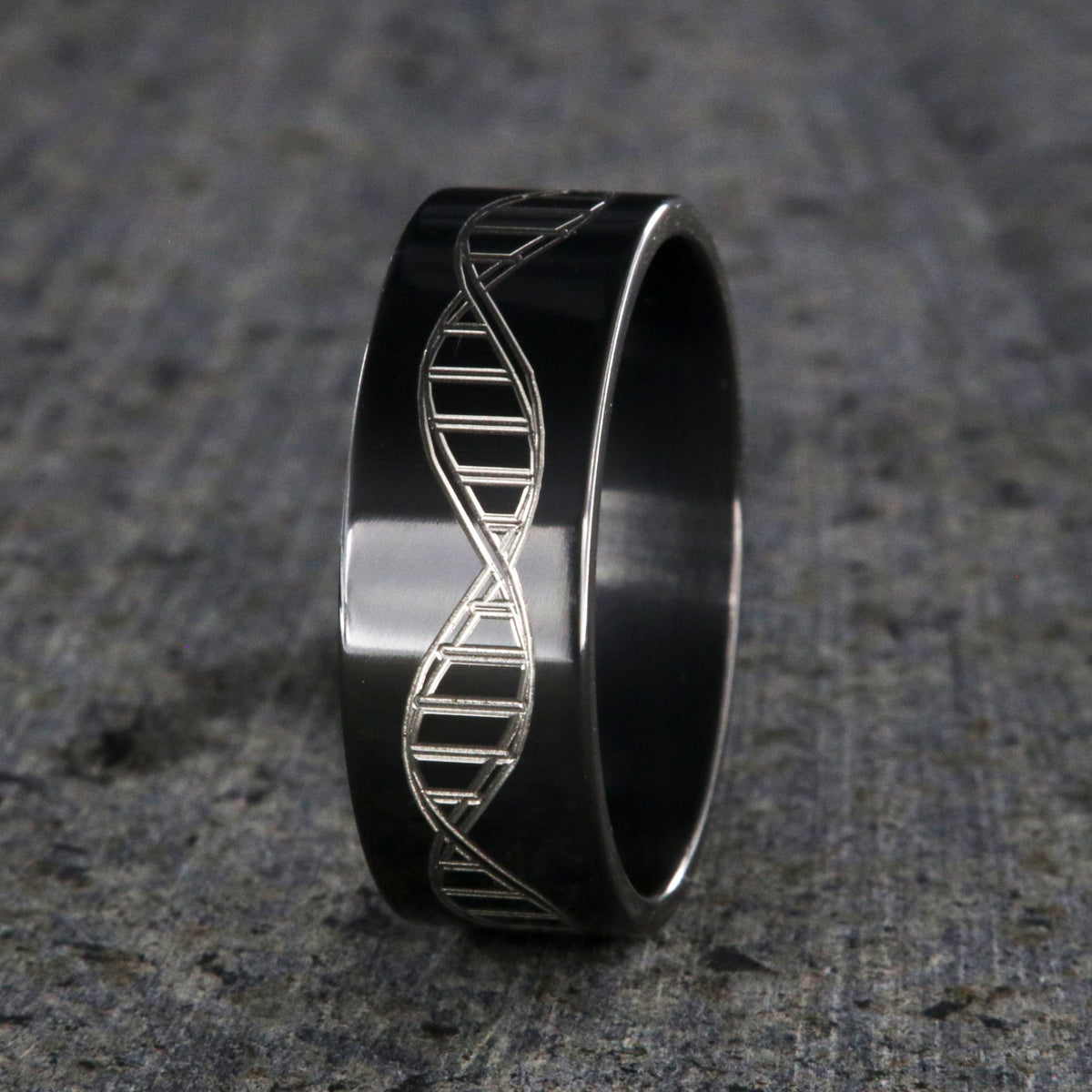 8mm wide black zirconium wedding ring with an etched DNA design