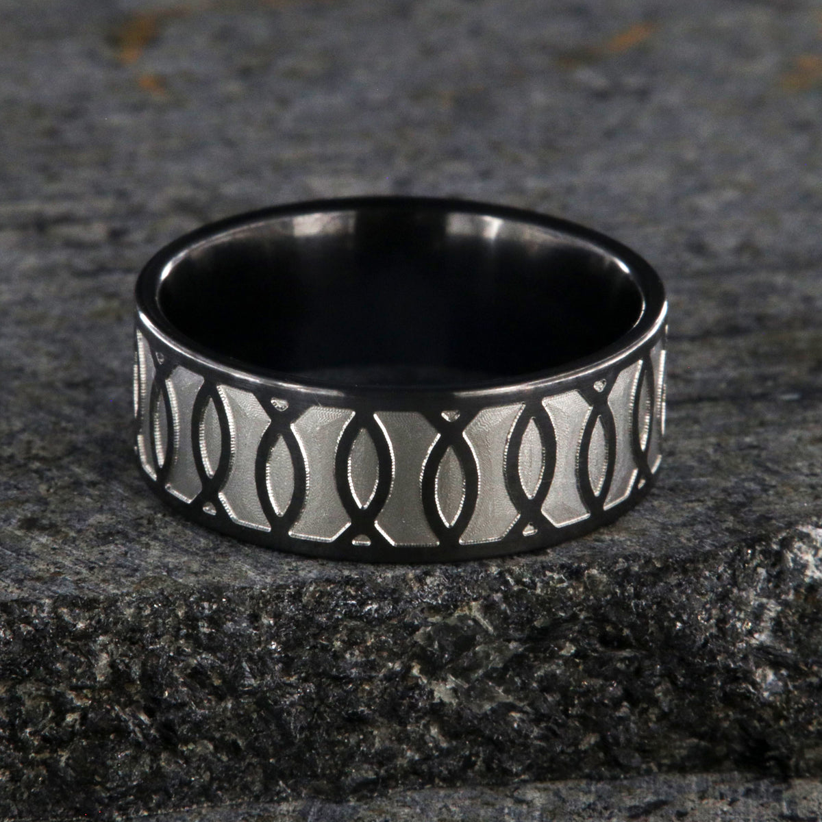 8mm wide black zirconium ring with a Jesus fish design