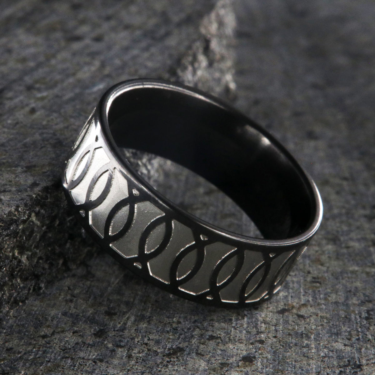 8mm wide black zirconium ring with a Jesus fish design
