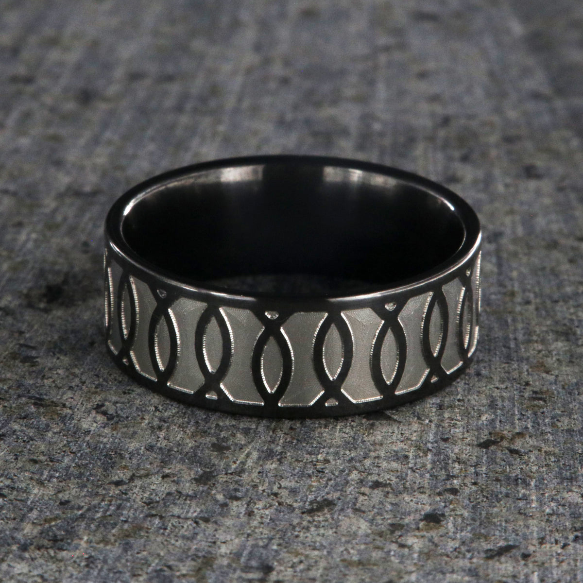 8mm wide black zirconium ring with a Jesus fish design