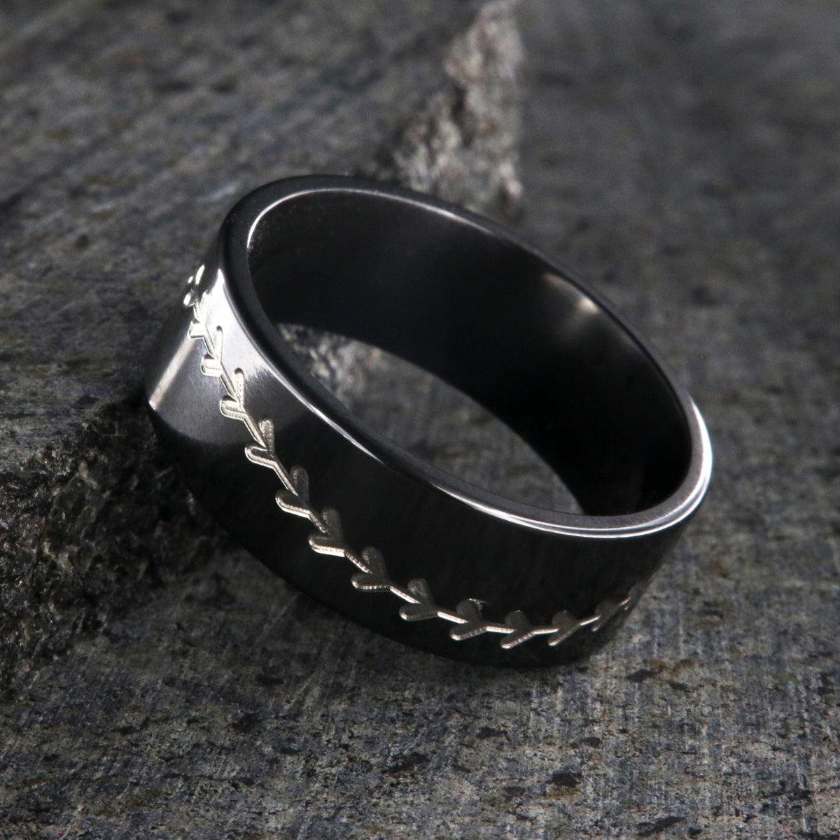 8mm wide black zirconium baseball ring with a flat profile and a two-tone baseball stitching