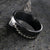 8mm wide black zirconium baseball ring with a flat profile and a two-tone baseball stitching