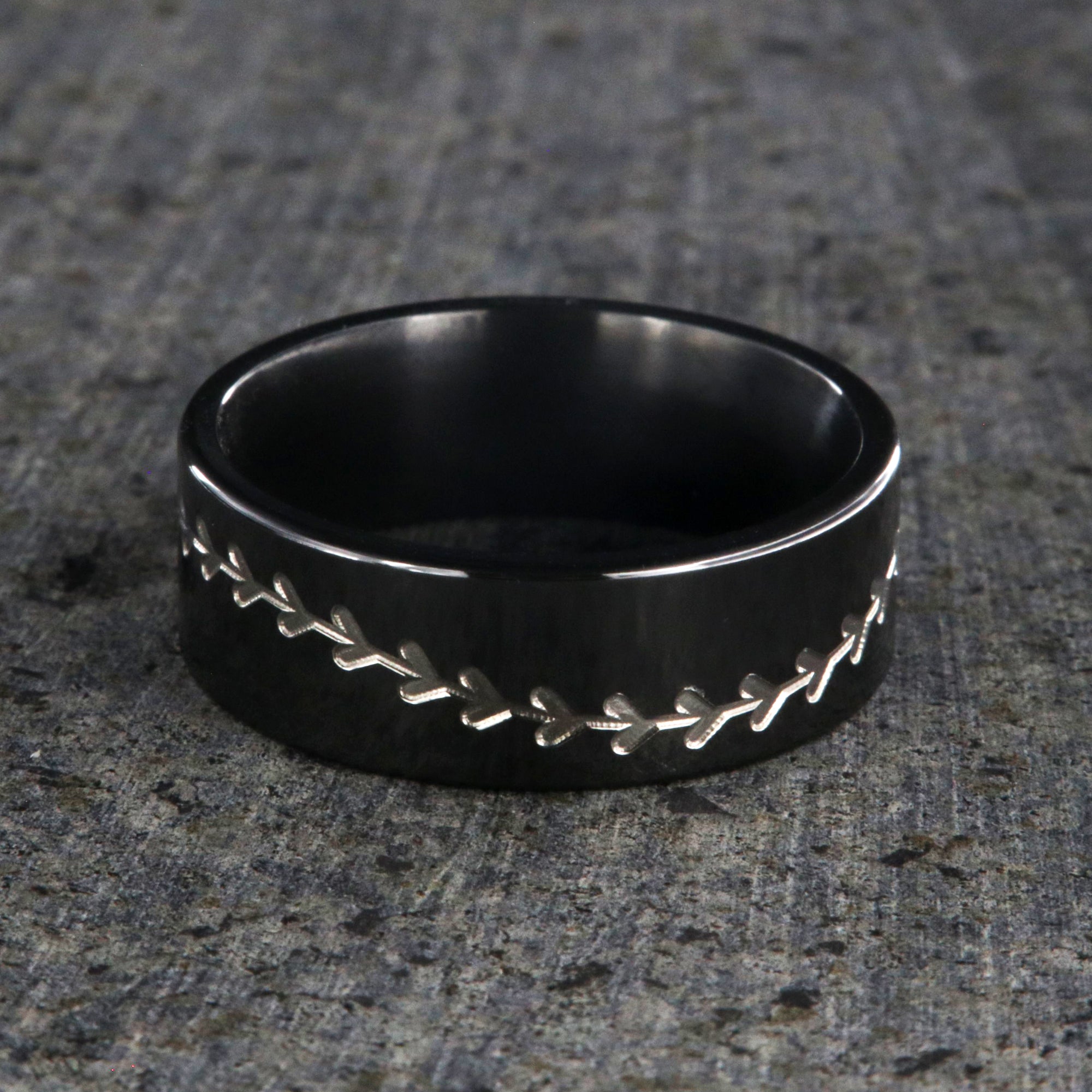 8mm wide black zirconium baseball ring with a flat profile and a two-tone baseball stitching