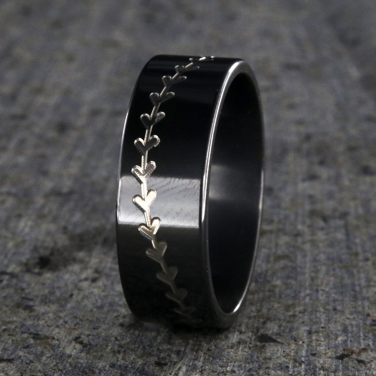 8mm wide black zirconium baseball ring with a flat profile and a two-tone baseball stitching