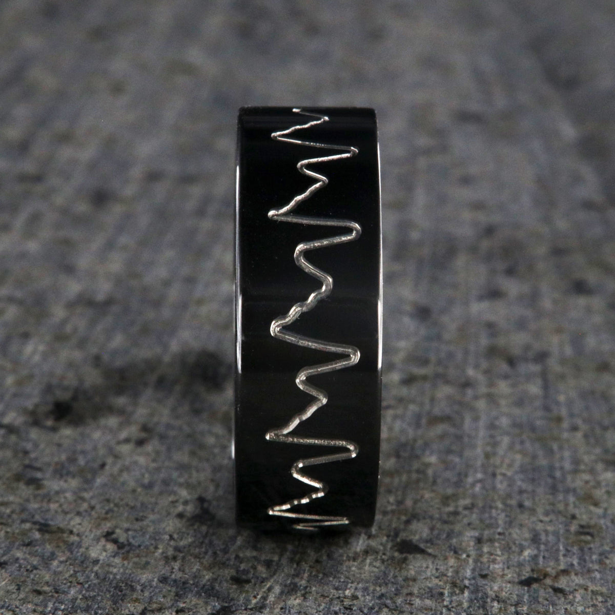 8mm wide black zirconium wedding band with an etched heartbeat design and a flat profile