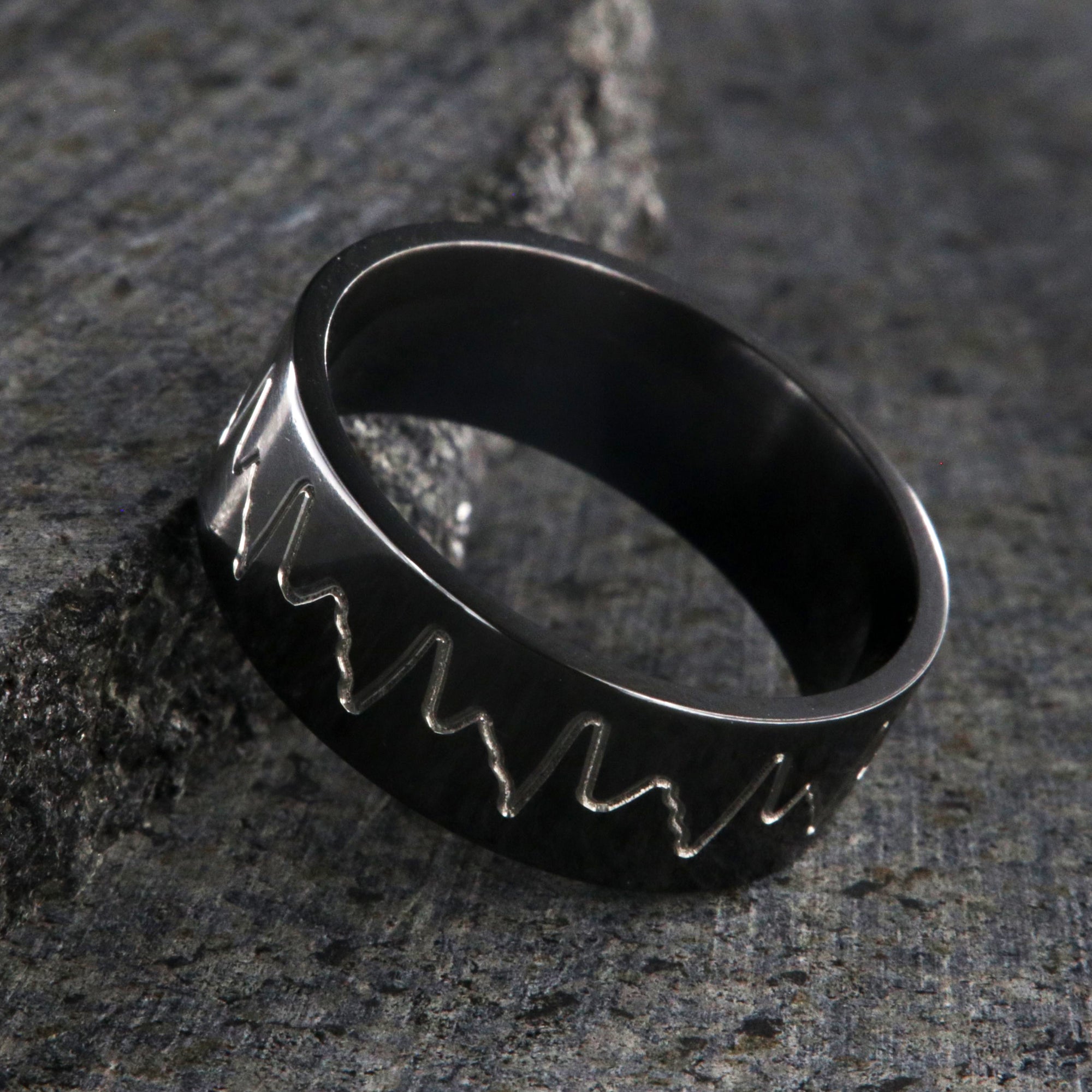 8mm wide black zirconium wedding band with an etched heartbeat design and a flat profile