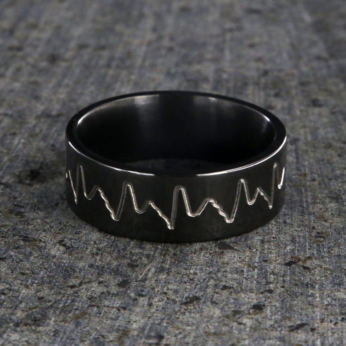 8mm wide black zirconium wedding band with an etched heartbeat design and a flat profile