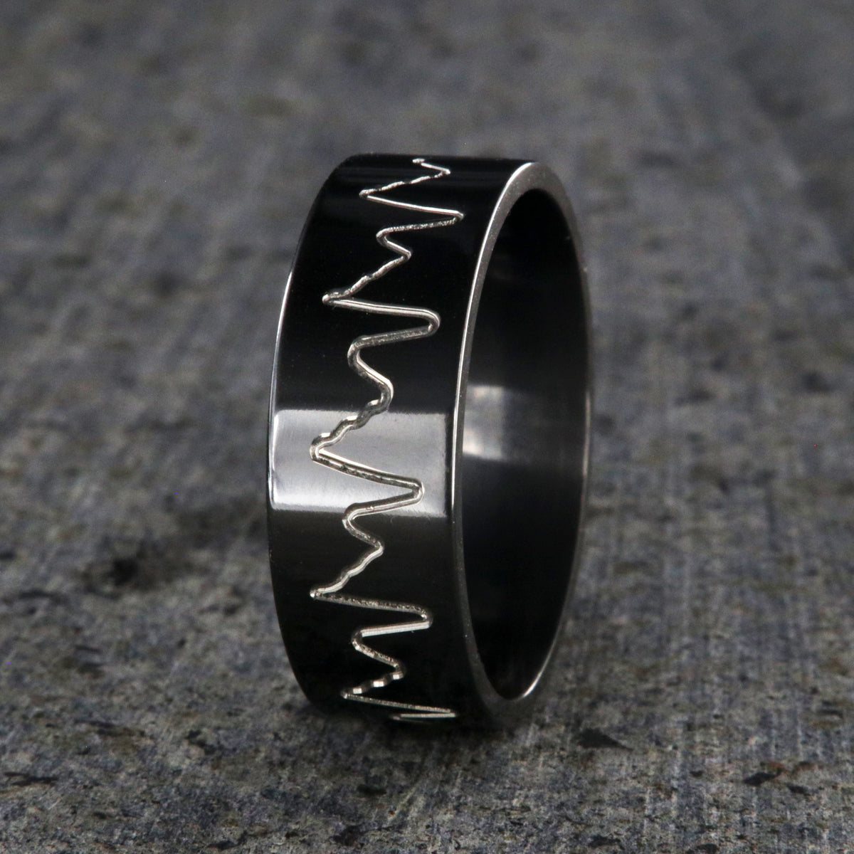 8mm wide black zirconium wedding band with an etched heartbeat design and a flat profile