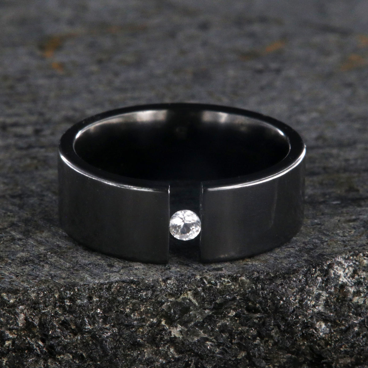 8mm wide black zirconium tension set ring with 3mm round gemstone