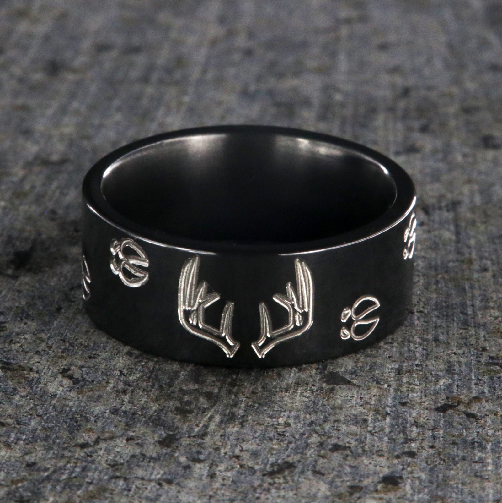 10mm wide black zirconium wedding band with a deer rack and tracks and a flat profile