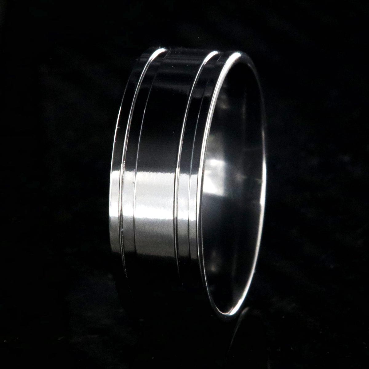 8mm wide polished black zirconium wedding band with dual edge grooves