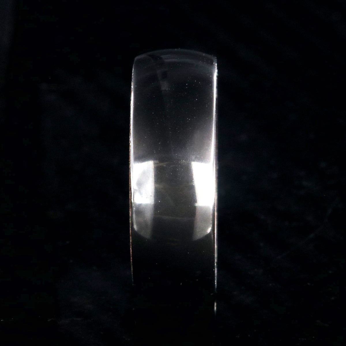 8mm wide black zirconium ring with a polish finish and bloodwood sleeve