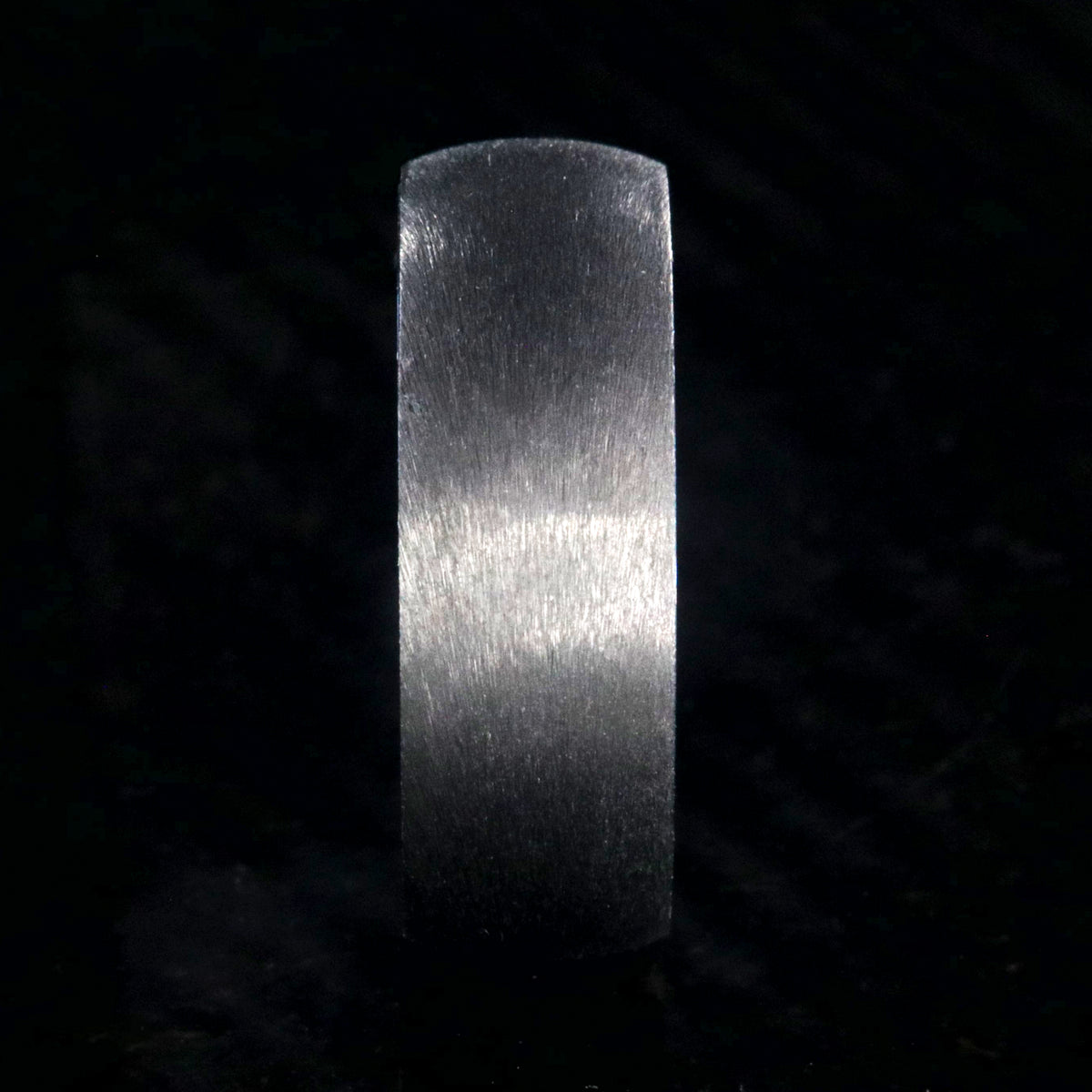 8mm wide titanium ring with a stone finish and blue sleeve