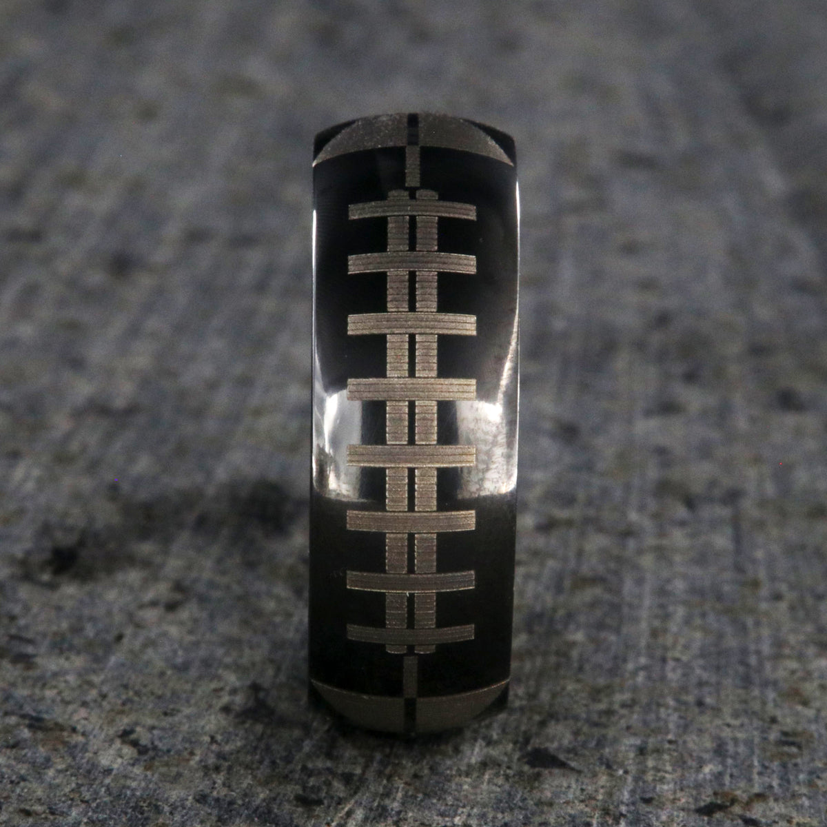 8mm wide black zirconium ring with football design