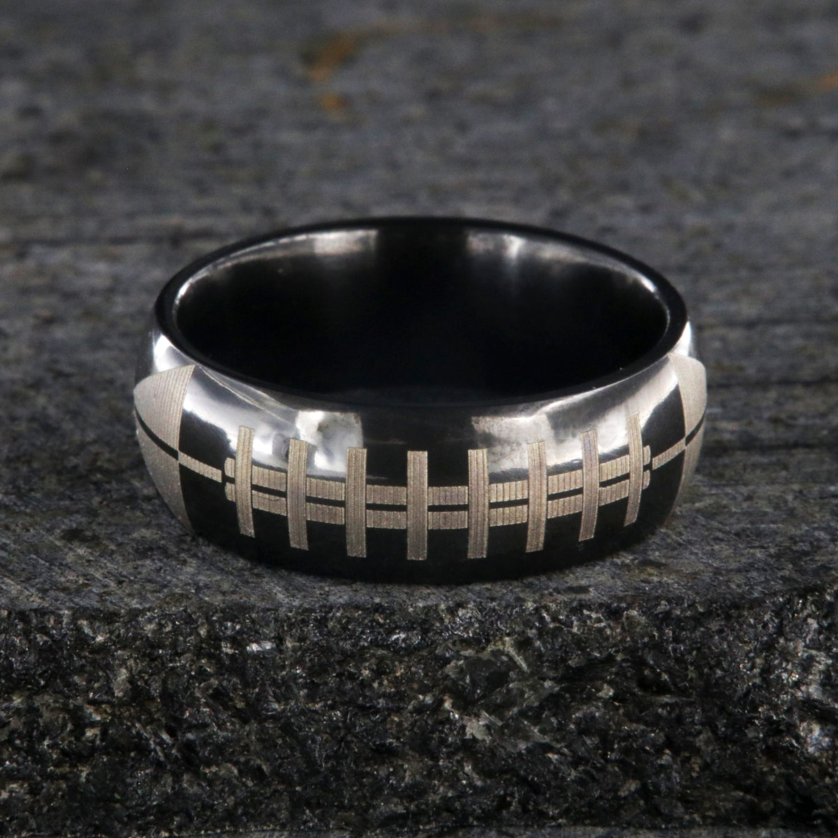 8mm wide black zirconium ring with football design