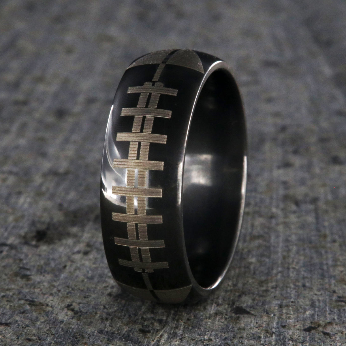 8mm wide black zirconium ring with football design