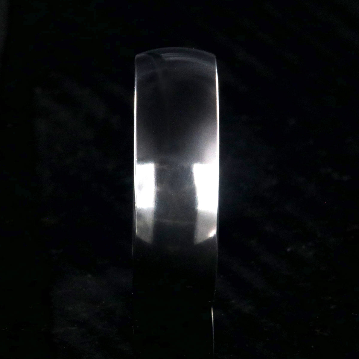 8mm wide black zirconium wedding band with a polished finish and rounded profile